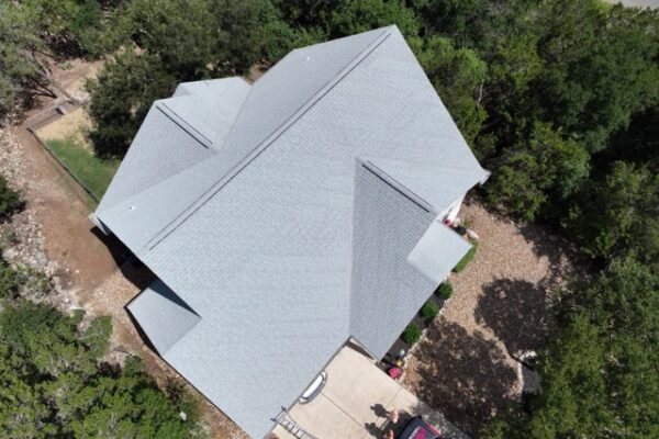 Sleek gray shingles newly installed on residence in San Antonio, Texas.