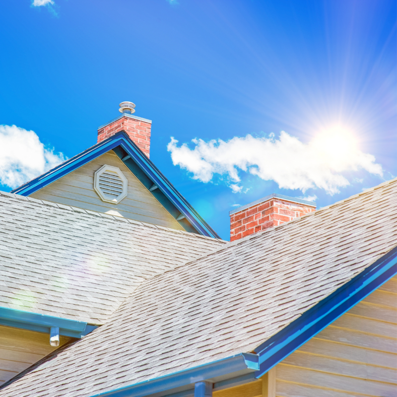 sun shining above shingle roof